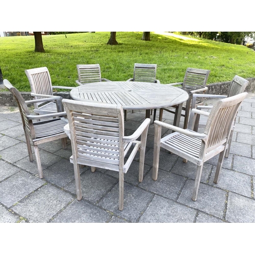 355 - GARDEN TABLE AND ARMCHAIRS, weathered, eight stacking armchairs included 64cm W, table 130cm W. (9)