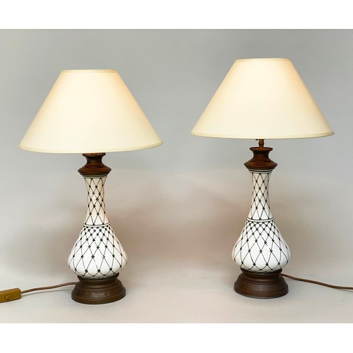 148 - TABLE LAMPS, a pair, baluster form vase shaped and trellis decorated with gilt metal mounts and shad... 