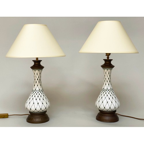 148 - TABLE LAMPS, a pair, baluster form vase shaped and trellis decorated with gilt metal mounts and shad... 