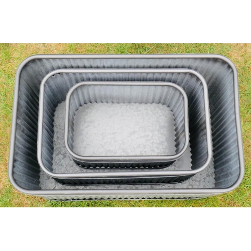 338 - TROUGH PLANTERS, a graduated set of three, galvanised, 33cm x 60cm x 38cm at largest (3)