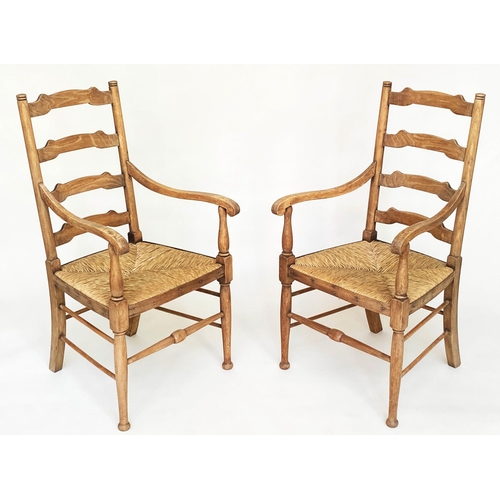 165 - ARMCHAIRS, a pair, early 20th century English oak with ladder backs and rush seats, 55cm W. (2)