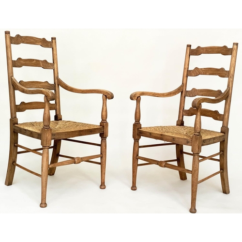 165 - ARMCHAIRS, a pair, early 20th century English oak with ladder backs and rush seats, 55cm W. (2)