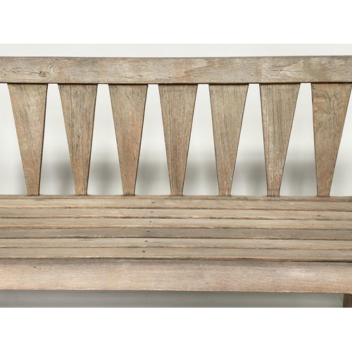 167 - GARDEN BENCH, weathered teak of slatted construction with triangular splat back, 140cm W.