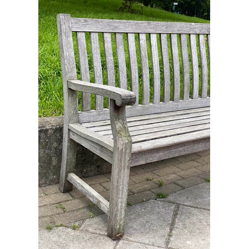 169 - GARDEN BENCH, silvery weathered teak of slatted and pegged construction, 152cm W.