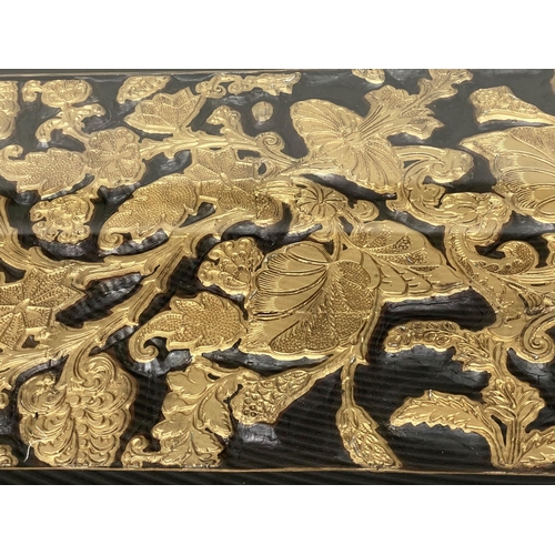 168 - LOW TABLE, Chinese lacquered and gilt, rectangular with carved giltwood foliate panel and glass top,... 