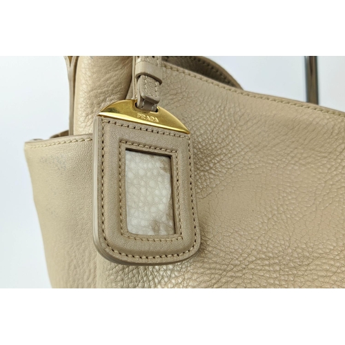18 - PRADA SHOULDER BAG, in grained leather with fabric lining, magnetic fastener and side zippered closu... 