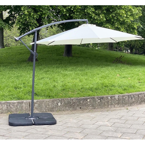114 - SUN UMBRELLA, circular cream canvas retractable wind up with frame and weights, 300cm W.