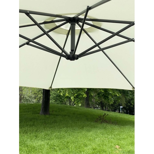 114 - SUN UMBRELLA, circular cream canvas retractable wind up with frame and weights, 300cm W.