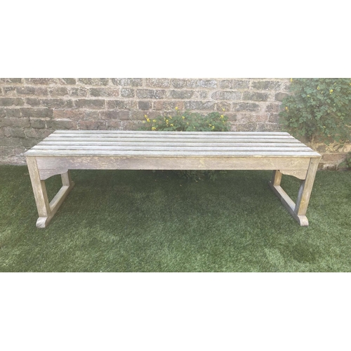 116 - LOW TABLE, rectangular weathered teak and slatted with stretchered supports, 149cm x 43cm x 42cm H.