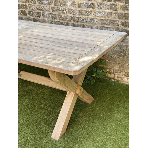 299 - GARDEN TABLE, rectangular weathered teak and slatted with substantial X frame support, 86cm x 183cm ... 