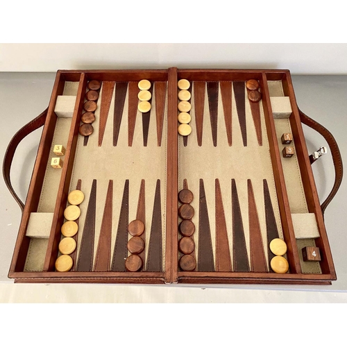 426 - BACKGAMMON SET, in leathered case, 7cm x 23cm x 40cm.