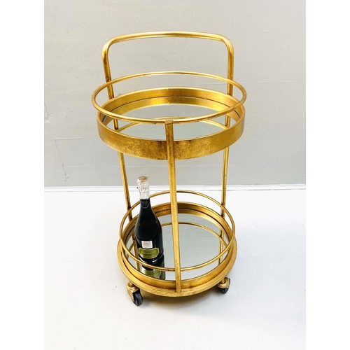 458 - COCKTAIL TROLLEY, 77cm high, 42cm diameter, 1960s French style, mirrored glass tiers, gilt metal fra... 