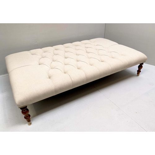 464 - HEARTH STOOL, 152cm x 92cm x 38cm, deep buttoned neutral upholstery, turned feet.