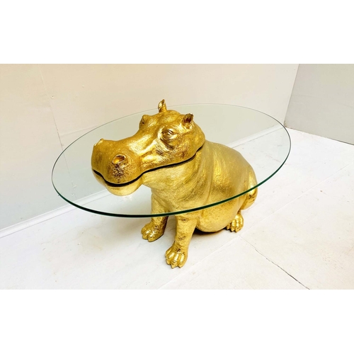 467 - LOW TABLE, 65cm high, 50cm wide, 45cm deep, in the form of a Hippo in water, glass top and gilt resi... 