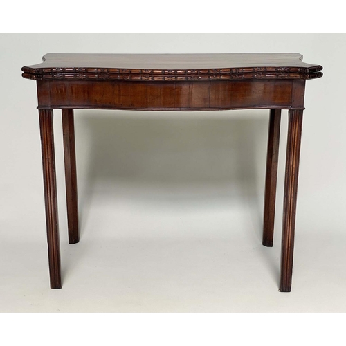 91 - TEA TABLE, George III figured mahogany of serpentine outline, foldover, with channeled square suppor... 