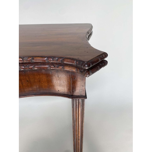 91 - TEA TABLE, George III figured mahogany of serpentine outline, foldover, with channeled square suppor... 