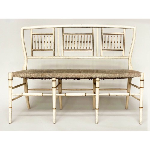 246 - HALL SEAT, 19th century Aesthetic cream and gilt heightened with rail back and rush seat, 117cm W.