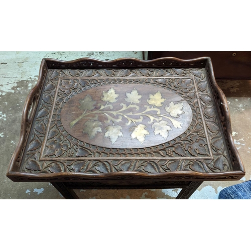 128 - TRAY TABLE, Anglo-Indian brass inlaid foliage decoration, foliage and vine carving throughout, foldi... 