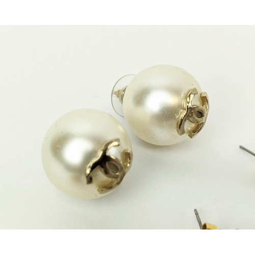 22 - CHANEL EARRINGS, three pairs, comprising a pair of large faux pearl earrings bearing the overlaid lo... 