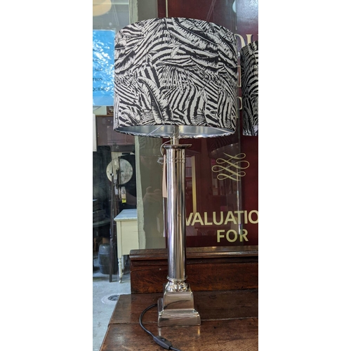 360 - TABLE LAMPS, a pair, polished metal column design, black and white foliate print shades, 81cm H x 36... 