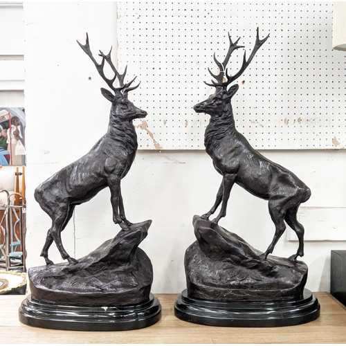 377 - AFTER J MOIGNIES, a pair of stags, bronze, 73cm H on marble bases. (2)