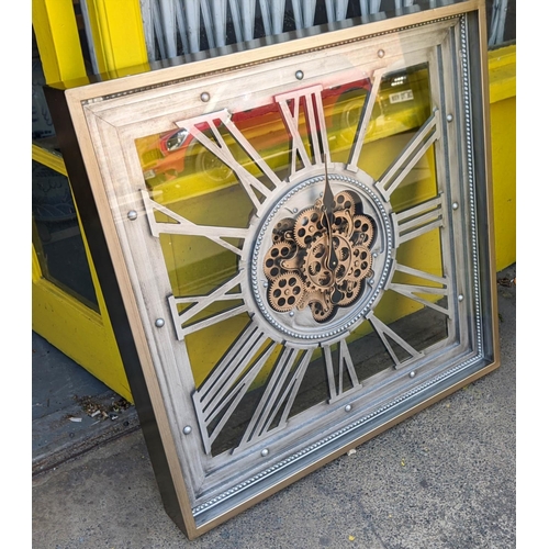 423 - WALL CLOCK, steam pink style design, enclosed in gass framed case.