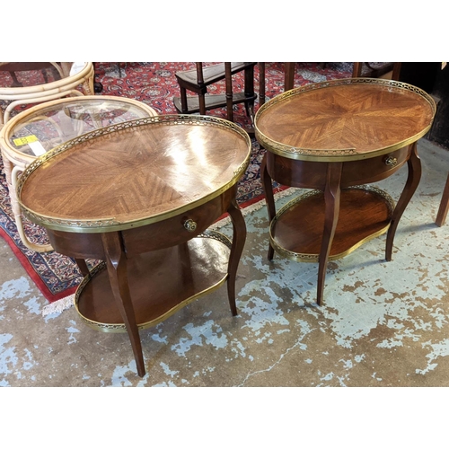 244 - OCCASIONAL TABLES, a pair, the figured mahogany oval tops with pierced brass gallery with undertier,... 