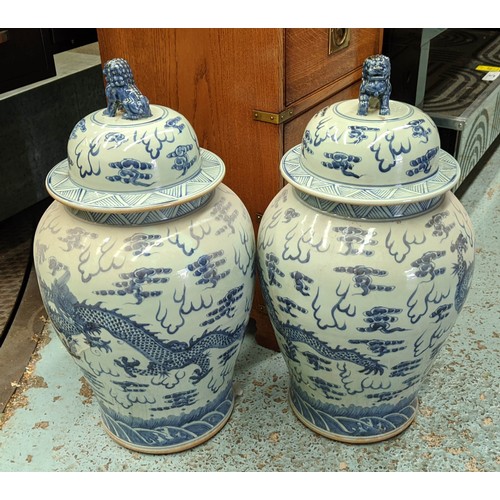 424 - TEMPLE JARS, a pair, Chinese export style, blue and white ceramic. (2)