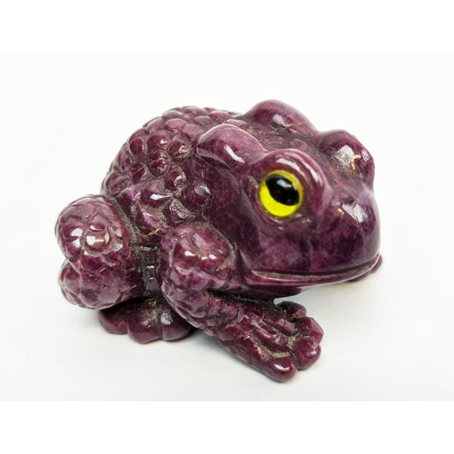 5 - A RUBY CARVED TOAD, glass eyes, initialled 'H.W.', 4cm long, 72 grams.