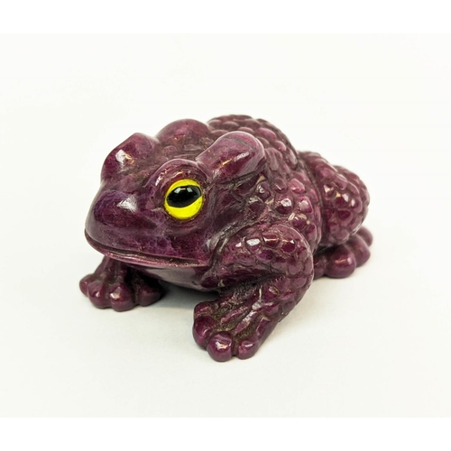 5 - A RUBY CARVED TOAD, glass eyes, initialled 'H.W.', 4cm long, 72 grams.