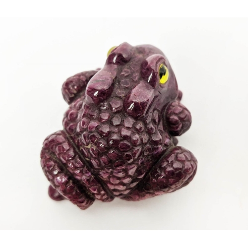 5 - A RUBY CARVED TOAD, glass eyes, initialled 'H.W.', 4cm long, 72 grams.