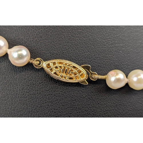 7 - THREE PEARL NECKLACES, comprising a three-strand cultured pearl necklace, with gilt metal clasp, a t... 