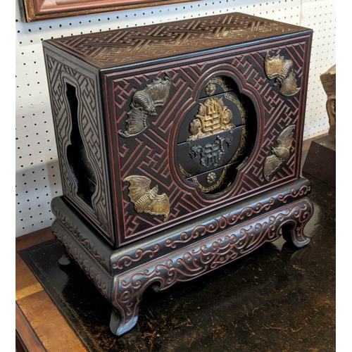 10 - CHINESE COMPARTMENTALISED LACQUERED BOX ON STAND, in four sections, incised decoration with metal ba... 