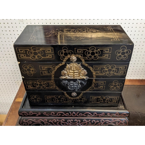 10 - CHINESE COMPARTMENTALISED LACQUERED BOX ON STAND, in four sections, incised decoration with metal ba... 