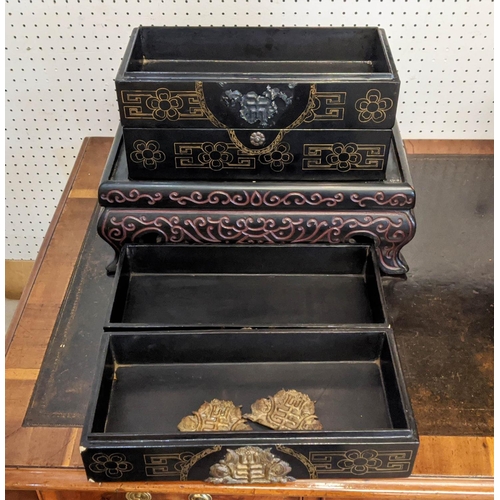 10 - CHINESE COMPARTMENTALISED LACQUERED BOX ON STAND, in four sections, incised decoration with metal ba... 