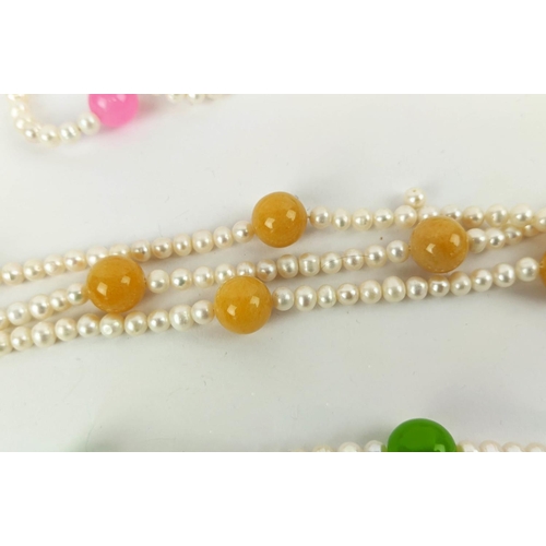 11 - A COLLECTION OF ASSORTED DYED JADE AND FRESHWATER PEARL NECKLACE AND BRACELET SETS, comprising many ... 