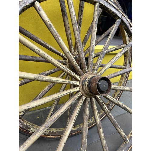 12 - WAGON WHEELS, a pair, wooden spokes with iron and rim in distressed yellow rubber painted finish, 11... 