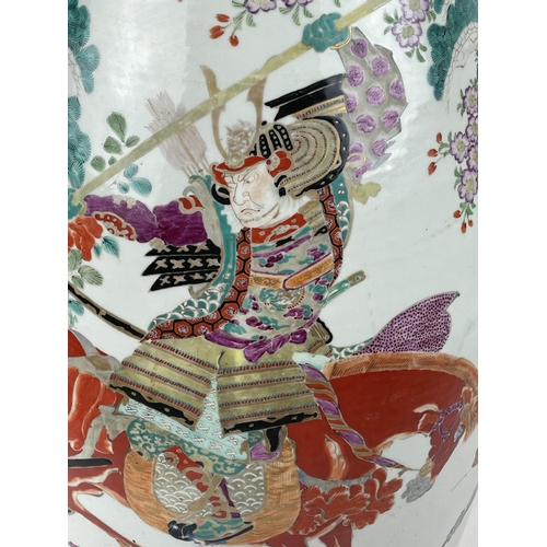 13 - JAPANESE IMARI VASE, large form decoration with warring samurai, 102cm H.