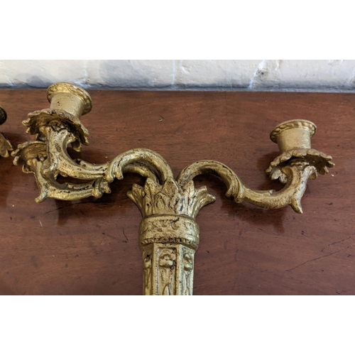 27 - BRASS WALL SCONCES, a pair, each with three branch, 16cm H x 32cm, and another pair gilt, each 47cm ... 