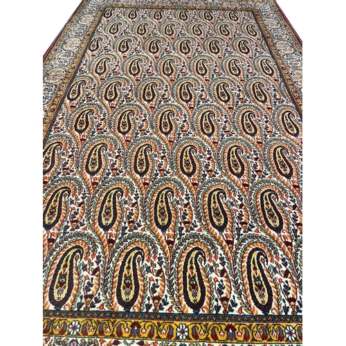 96 - PAISLEY DESIGN PERSIAN QUM CARPET, 264cm x 156cm.