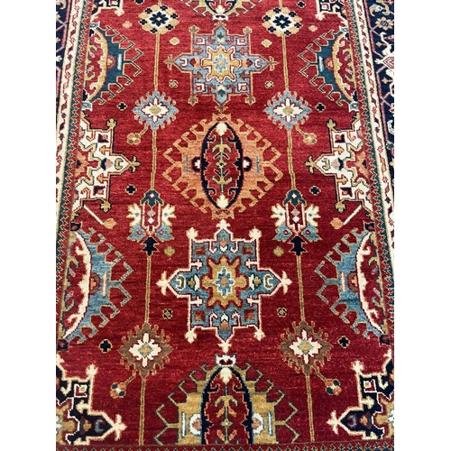 102 - FINE HERIZ RUG, 216cm x 150cm.