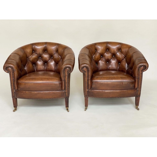 131 - TUB LIBRARY ARMCHAIRS, a pair, Edwardian style deep buttoned tan brown leather upholstered with bow ... 