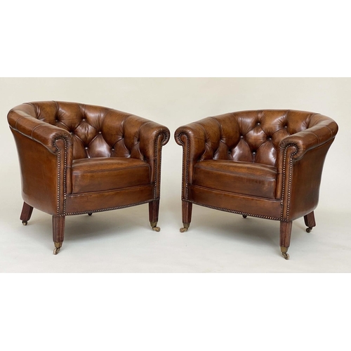 131 - TUB LIBRARY ARMCHAIRS, a pair, Edwardian style deep buttoned tan brown leather upholstered with bow ... 