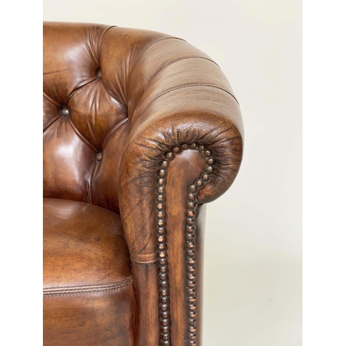 131 - TUB LIBRARY ARMCHAIRS, a pair, Edwardian style deep buttoned tan brown leather upholstered with bow ... 