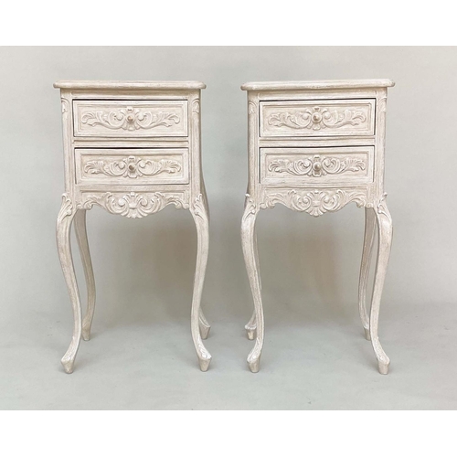 135 - BEDSIDE CHESTS, a pair, French Louis XV style traditionally carved and grey painted each with two dr... 