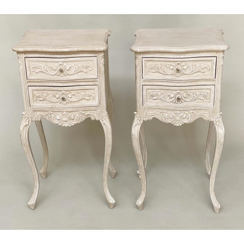 135 - BEDSIDE CHESTS, a pair, French Louis XV style traditionally carved and grey painted each with two dr... 