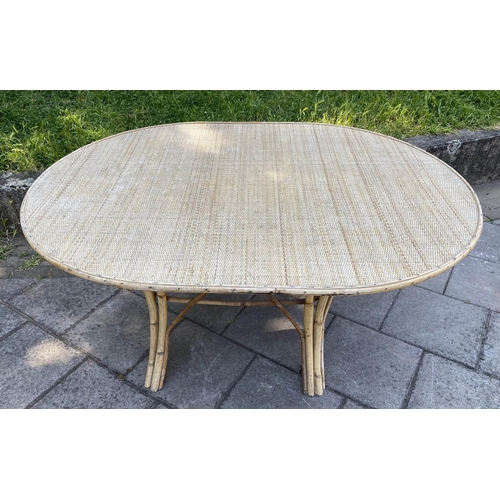 137 - DINING TABLE, 1970's oval bamboo framed and cane and wicker panelled, 151cm x 11cm D x 74cm H.