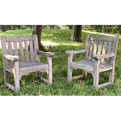 140 - GARDEN ARMCHAIRS, a pair, silvery weathered teak of substantial slatted and pegged construction by W... 