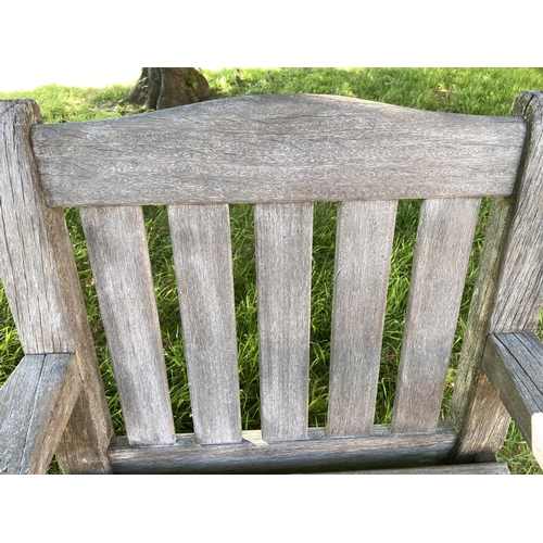 140 - GARDEN ARMCHAIRS, a pair, silvery weathered teak of substantial slatted and pegged construction by W... 