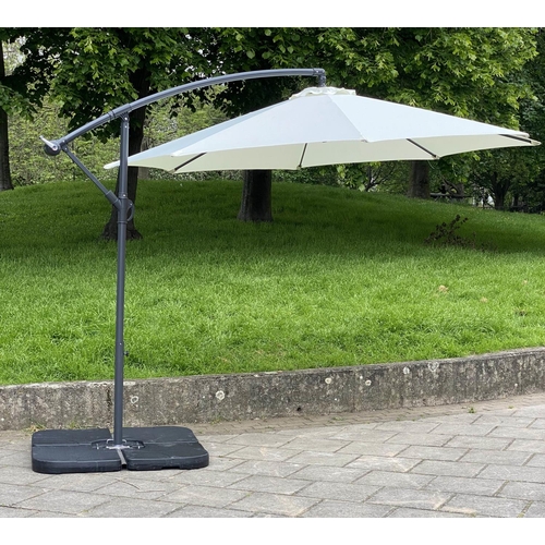 141 - GARDEN SUN UMBRELLA, circular cream canvas retractable wind up with frame and weights, 300cm W.